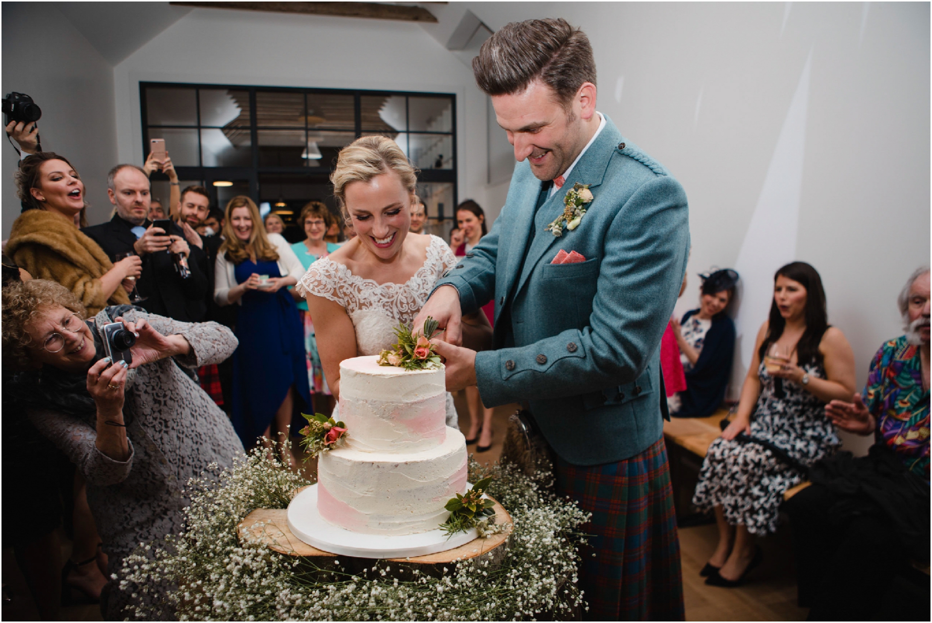 guardswell farm wedding bride and grooom cut their cake