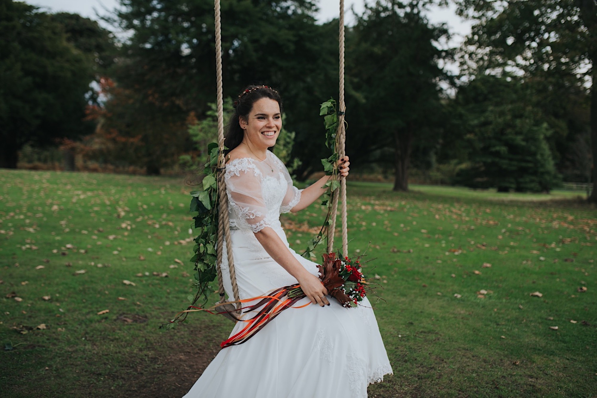 bride and groom on a swing at dunglass estate